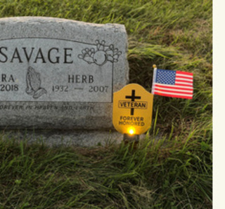 Veteran gravesite decorated with a memorial tribute
